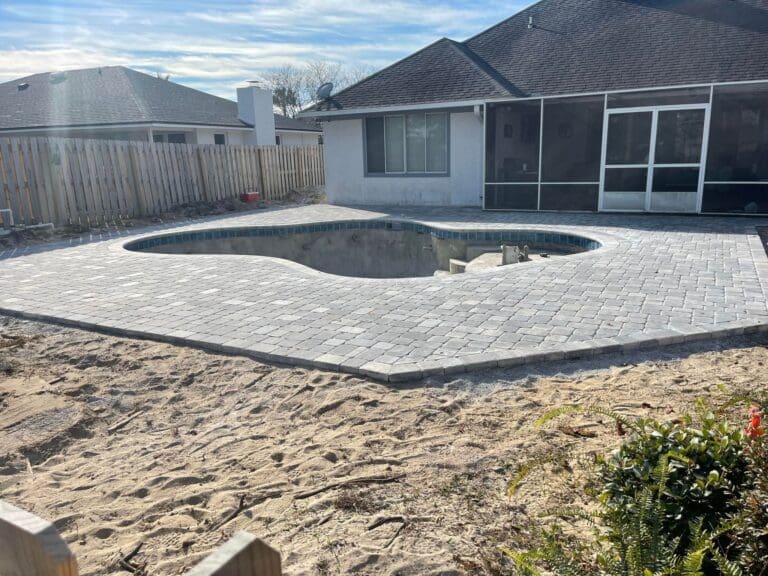 pool deck with pavers complete