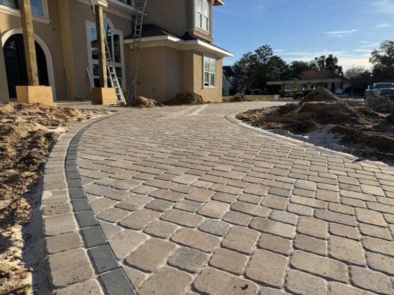 curved paver driveway for luxury home